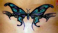 A low back butterfly tattoo