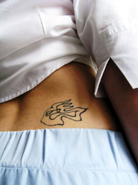 Low back female tattoo